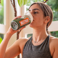 Woman drinking Bulletproof Greens powder