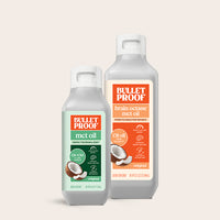 Two bottles of Bulletproof oil on a light beige background
