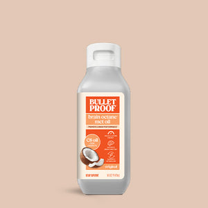 Bulletproof brain octane MCT oil bottle on a beige background