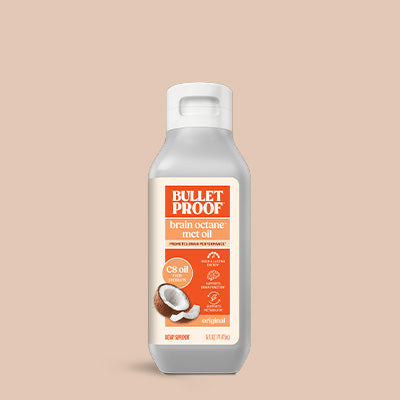 Bulletproof brain octane MCT oil bottle on a beige background