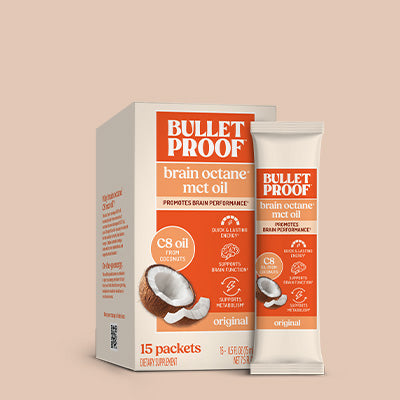 Bulletproof brain octane MCT oil packets on a beige background