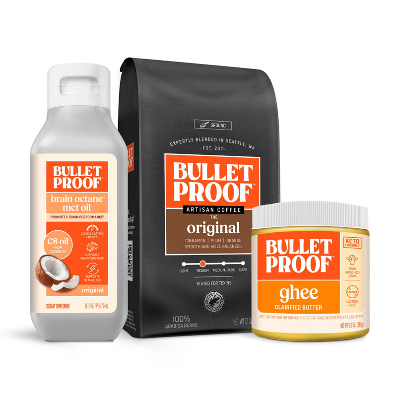 Bulletproof products including brain octane mct oil, ground coffee, and ghee on a white background