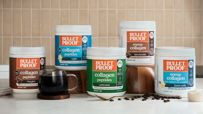Collection of Bulletproof collagen products on a kitchen counter with coffee and ingredients.