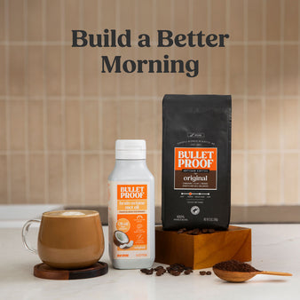 Bulletproof coffee setup with coffee, mct oil, and coffee beans on a kitchen counter.