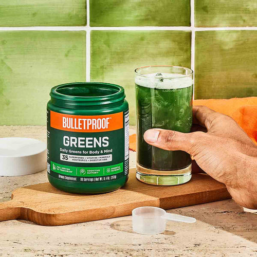 Bulletproof Greens powder mixed into glass of water