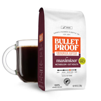 Image: Bulletproof The Maximizer Ground Coffee bag next to cup of coffee