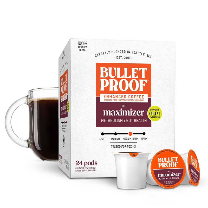 Bulletproof The Maximizer coffee pods next to cup of coffee