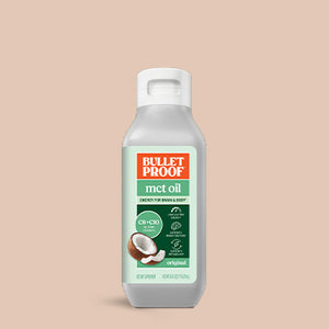 Bulletproof MCT oil bottle on a beige background