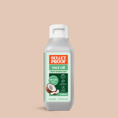 Bulletproof MCT oil bottle on a beige background
