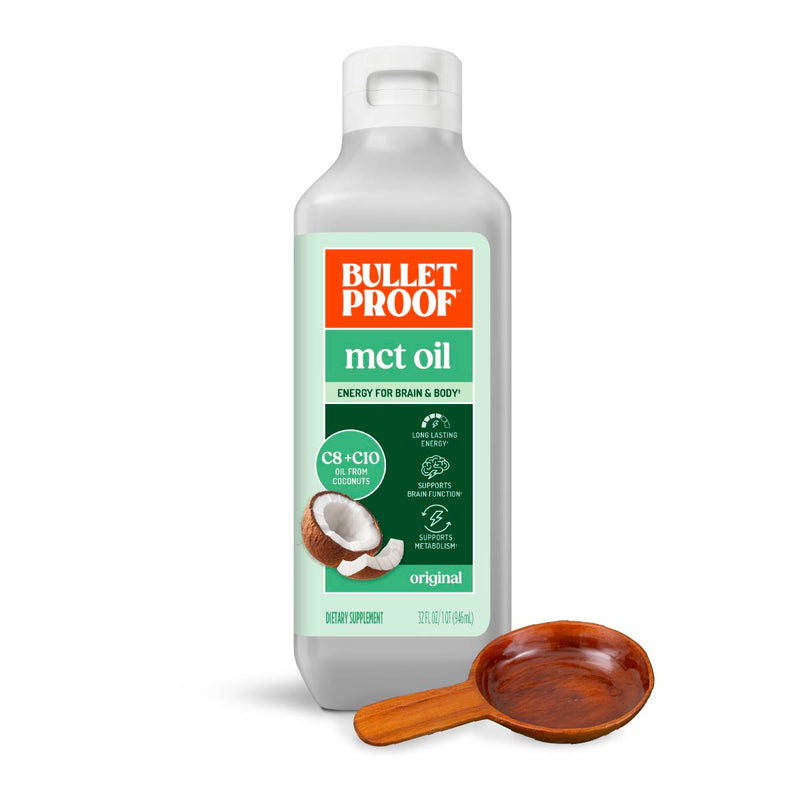 Bulletproof MCT oil bottle with a wooden scoop on a white background