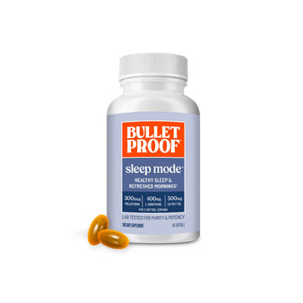 Image: Bulletproof Sleep Mode supplement bottle with two capsules on a white background