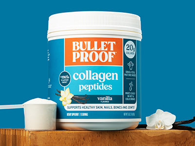 Bulletproof Vanilla Collagen Peptides container next to scoop of collagen