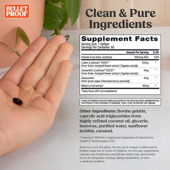 Bulletproof eye armor supplement facts and hand holding 1 softgel