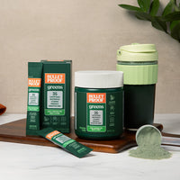  Bulletproof greens supplement packaging on a wooden board with a neutral background