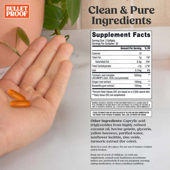 Bulletproof turmeric curcumin complex supplement facts next to hand holding two softgels