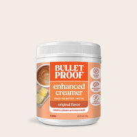 Bulletproof enhanced creamer container on a beige background