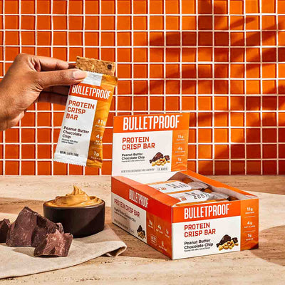 Bulletproof Peanut Butter Chocolate Chip Crisp Bar ingredients on orange tile