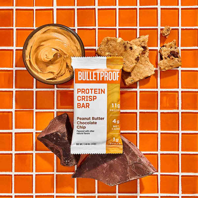Bulletproof Peanut Butter Chocolate Chip Crisp Bar with scoop of peanut butter and chocolate chunks
